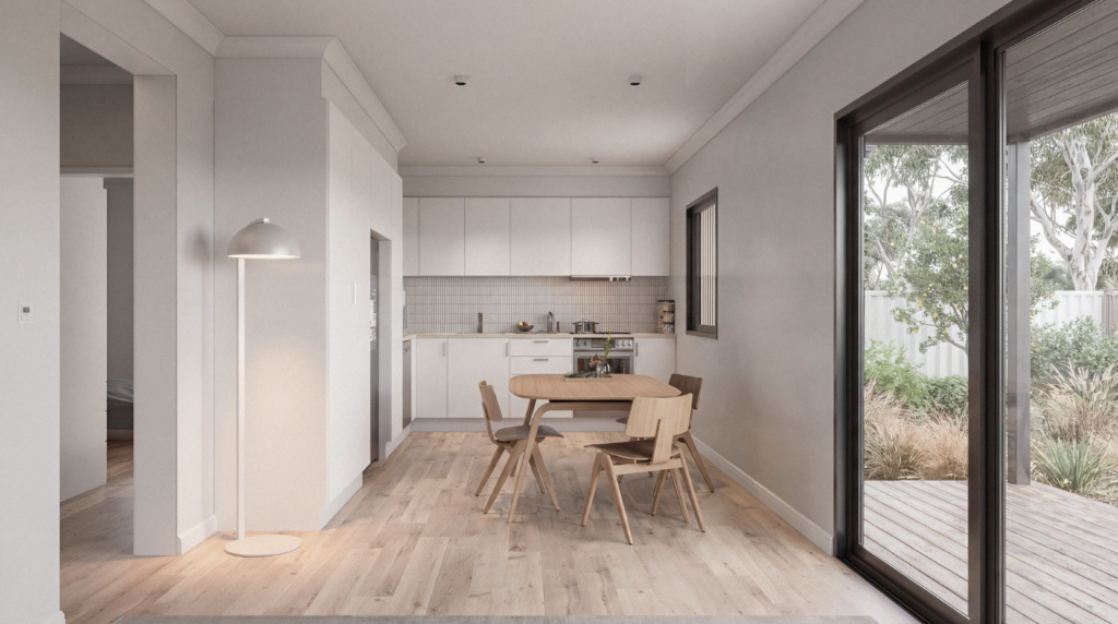 Duo-Forma open-plan kitchen and dining area with white cabinetry, timber dining setting and stacker doors opening to a timber deck and native garden